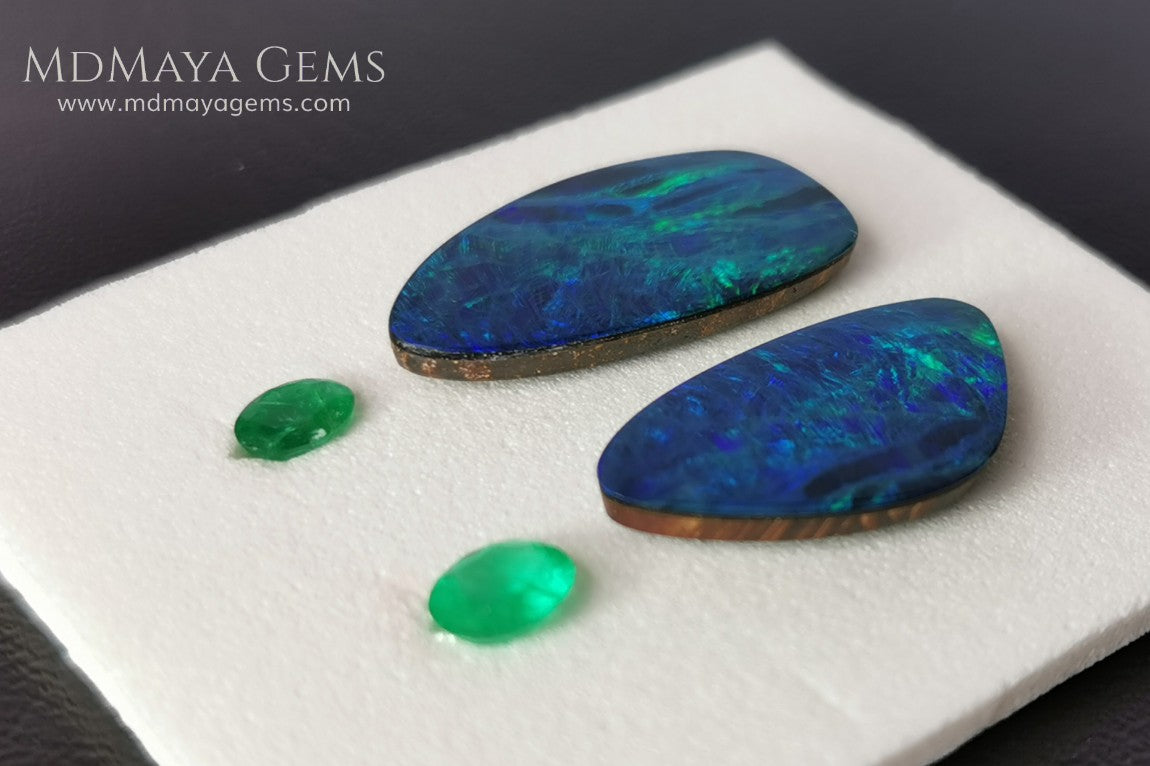  Opal Doublets and Emeralds. This set is composed by a pair of bright Australian Opal doublet and two vivid Zambian Emeralds. The perfect combination for your bespoke jewelry.