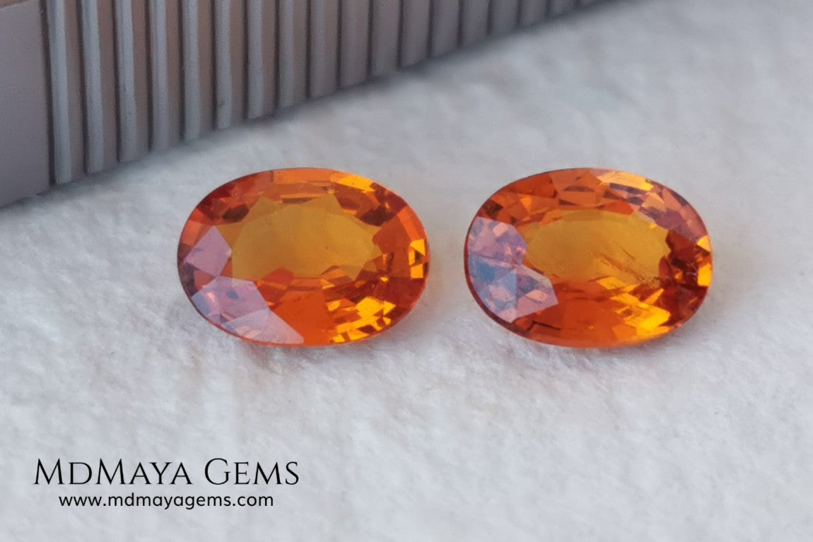  Pair Mandarin Garnet. Oval Cut. 1.82 ct total. Stunning and Bright Orange Spessartite Garnets. Beautiful pair of natural and untreated gemstones, they will be superb on some earrings. They are full of life, they are pure orange. Don't miss it!