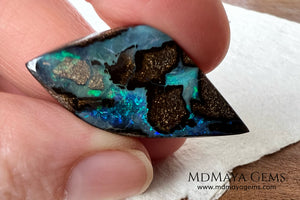 Stunning Boulder Opal 25.14 ct. from Australia. Cabochon Cut. Free Form. Imagine an island surrounded by deep blue-green waters, that's what this opal is.