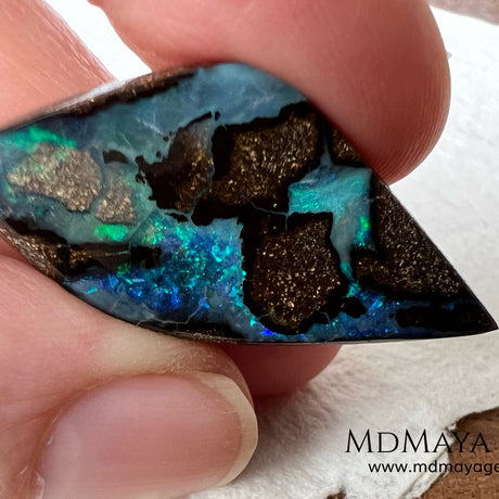 Stunning Boulder Opal 25.14 ct. from Australia. Cabochon Cut. Free Form. Imagine an island surrounded by deep blue-green waters, that's what this opal is.