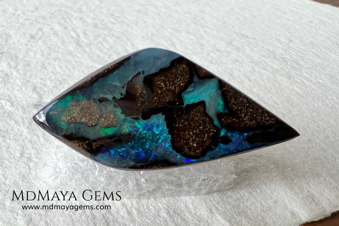 Stunning Boulder Opal 25.14 ct. from Australia. Cabochon Cut. Free Form. Imagine an island surrounded by deep blue-green waters, that's what this opal is.