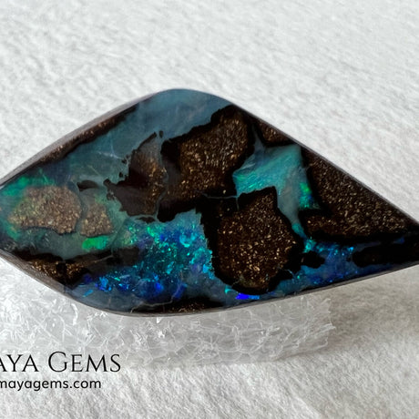 Stunning Boulder Opal 25.14 ct. from Australia. Cabochon Cut. Free Form. Imagine an island surrounded by deep blue-green waters, that's what this opal is.