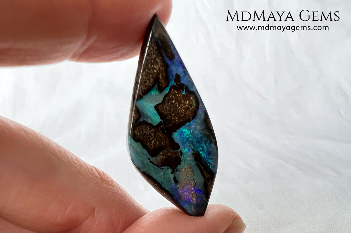 Stunning Boulder Opal 25.14 ct. from Australia. Cabochon Cut. Free Form. Imagine an island surrounded by deep blue-green waters, that's what this opal is.