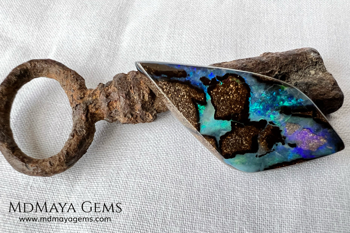Stunning Boulder Opal 25.14 ct. from Australia. Cabochon Cut. Free Form. Imagine an island surrounded by deep blue-green waters, that's what this opal is.