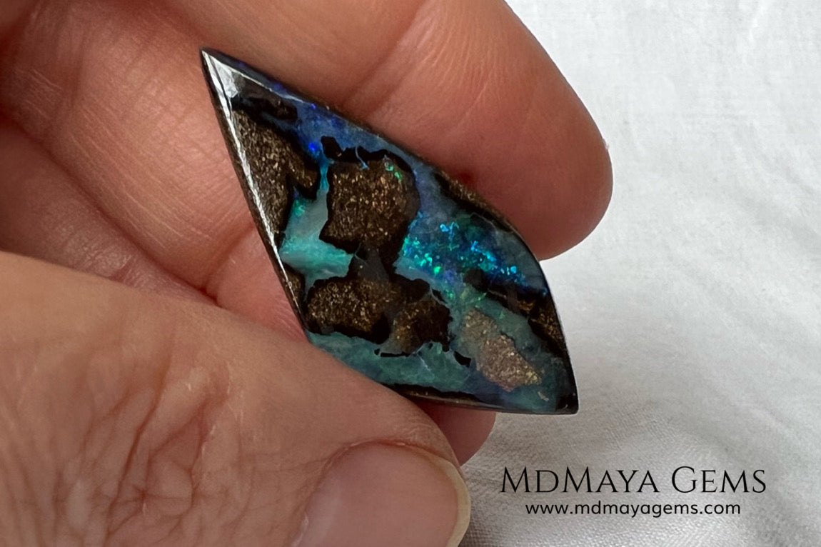 Stunning Boulder Opal 25.14 ct. from Australia. Cabochon Cut. Free Form. Imagine an island surrounded by deep blue-green waters, that's what this opal is.