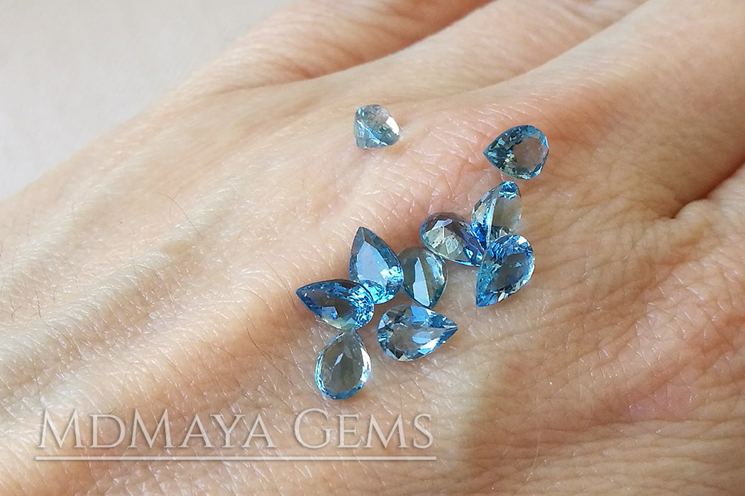 Blue Africana Aquamarine. 10 pieces. Pear cut. 3.86 ct total.