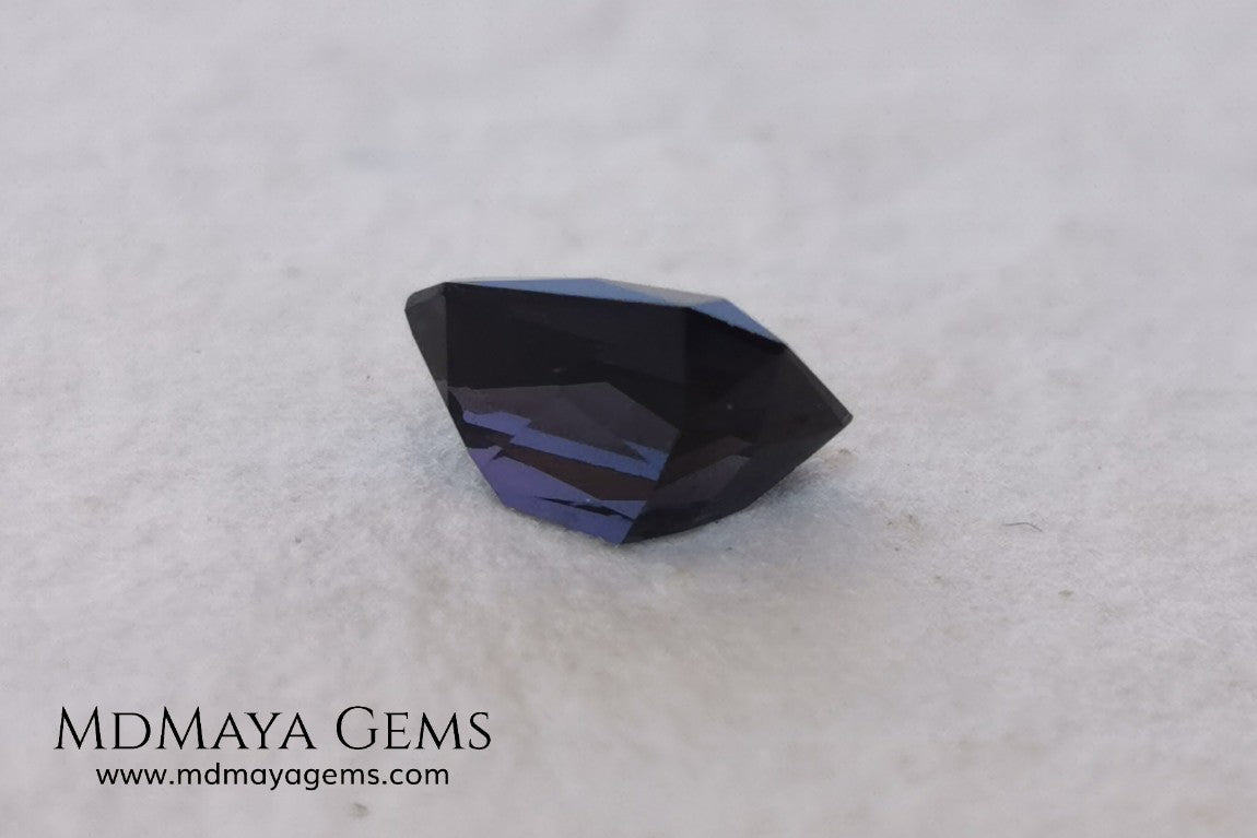 Beautiful dark spinel of 1.59 ct with a trapezoidal cut. This beauty under fluorescent light shows an incredible and sparkle dark blue color with violet tones. Its fancy cut is amazing. It is a very special gemstone, it will look wonderful in any piece of jewelry you can imagine.