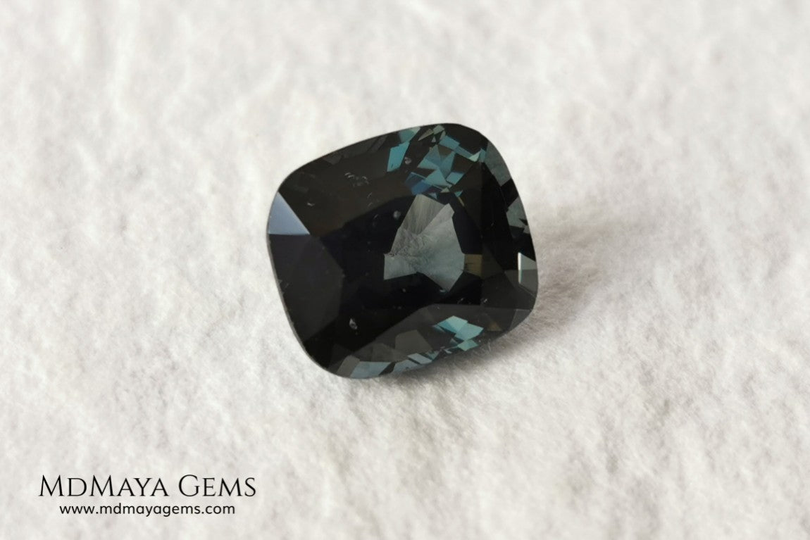 Gorgeous greenish gray spinel, 3.13 ct, cushion cut. This natural and untreated gemstone has an antique cut, its size is ideal, neither too big nor too small. Its behaviour under light is amazing, has a beautiful color under incandescent light, and contains a small treasure inside, another small spinel fully formed, a delight both outside and inside. Mother nature is perfect. It will be ideal in any jewel that you want to personalize. Spinels are gems with rising value.