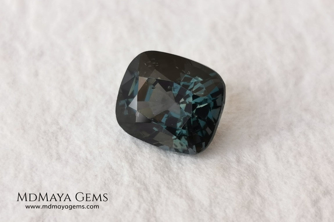 Gorgeous greenish gray spinel, 3.13 ct, cushion cut. This natural and untreated gemstone has an antique cut, its size is ideal, neither too big nor too small. Its behaviour under light is amazing, has a beautiful color under incandescent light, and contains a small treasure inside, another small spinel fully formed, a delight both outside and inside. Mother nature is perfect. It will be ideal in any jewel that you want to personalize. Spinels are gems with rising value.