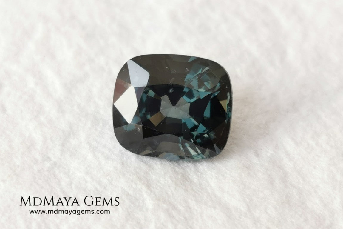 Gorgeous greenish gray spinel, 3.13 ct, cushion cut. This natural and untreated gemstone has an antique cut, its size is ideal, neither too big nor too small. Its behaviour under light is amazing, has a beautiful color under incandescent light, and contains a small treasure inside, another small spinel fully formed, a delight both outside and inside. Mother nature is perfect. It will be ideal in any jewel that you want to personalize. Spinels are gems with rising value.