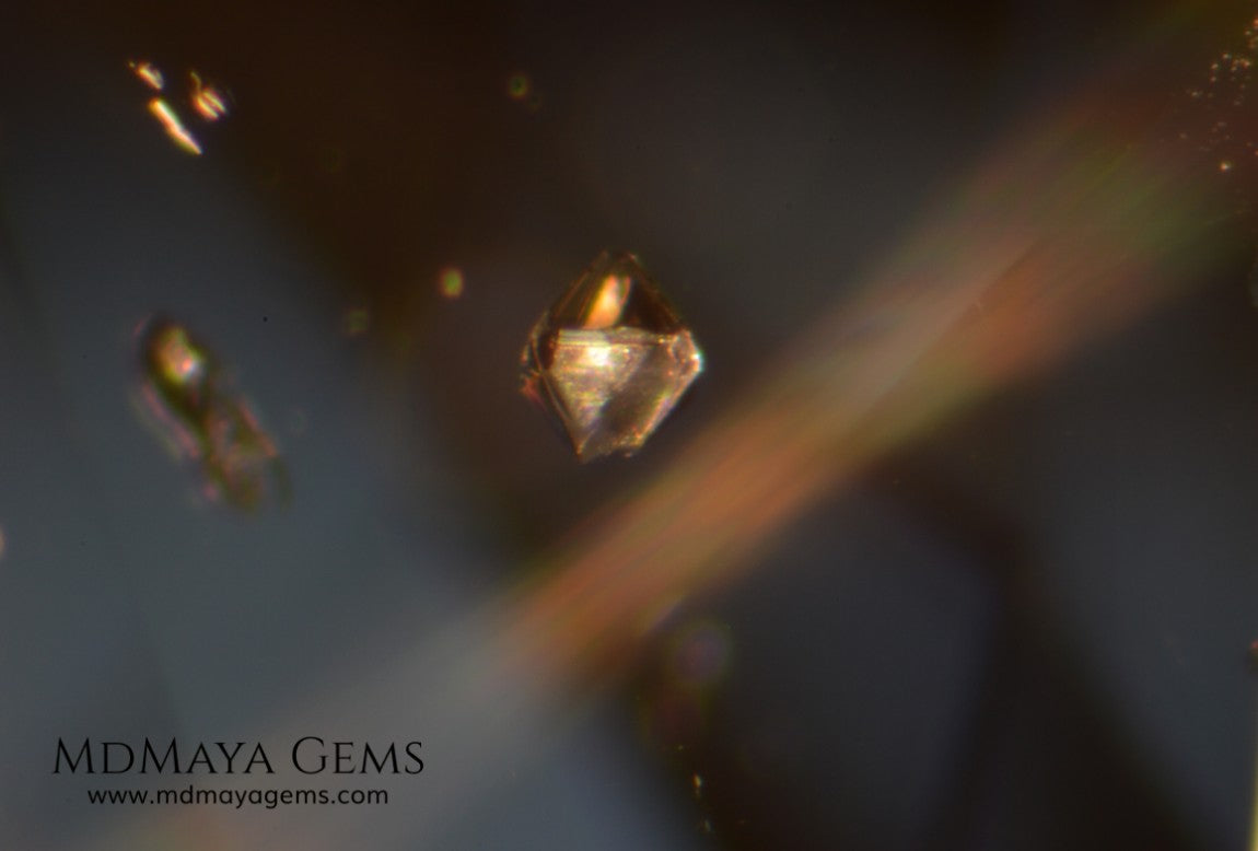 inclusions in untreated greenish gray spinel, 3.13 ct