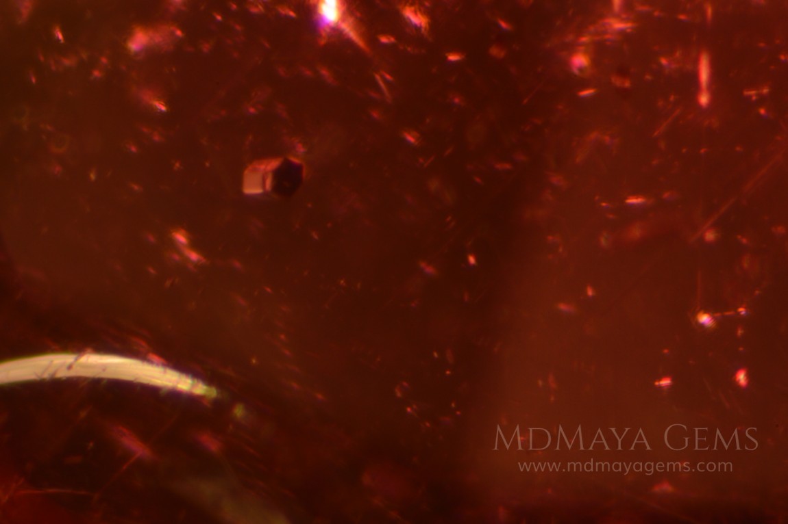 inclusions in purple red rhodolite pair 3.95 ct