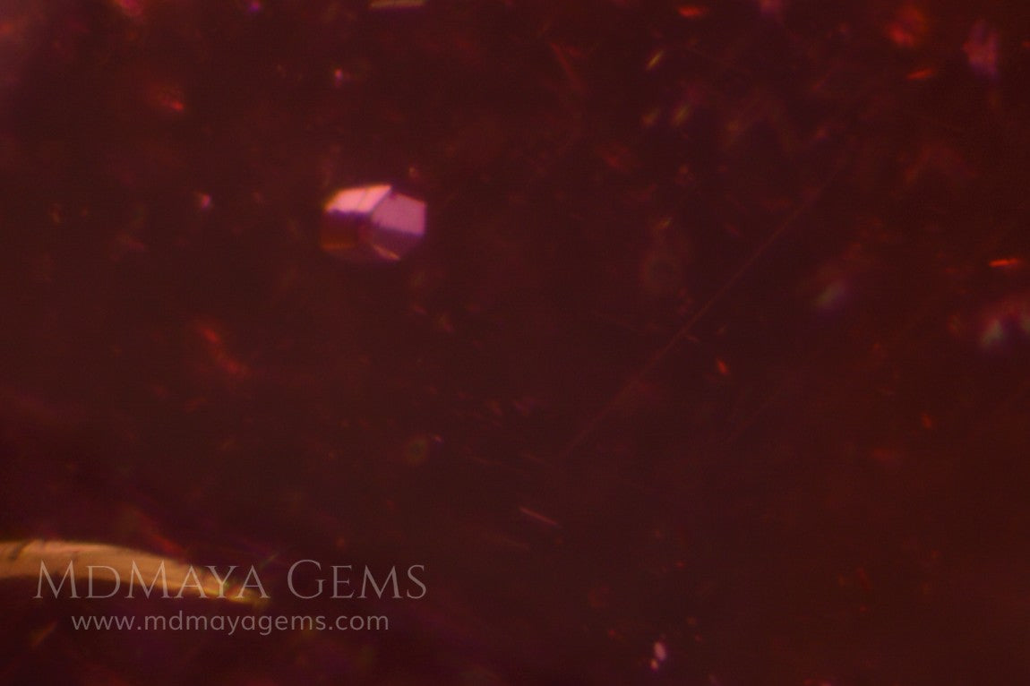 inclusions in purple red rhodolite pair 3.95 ct