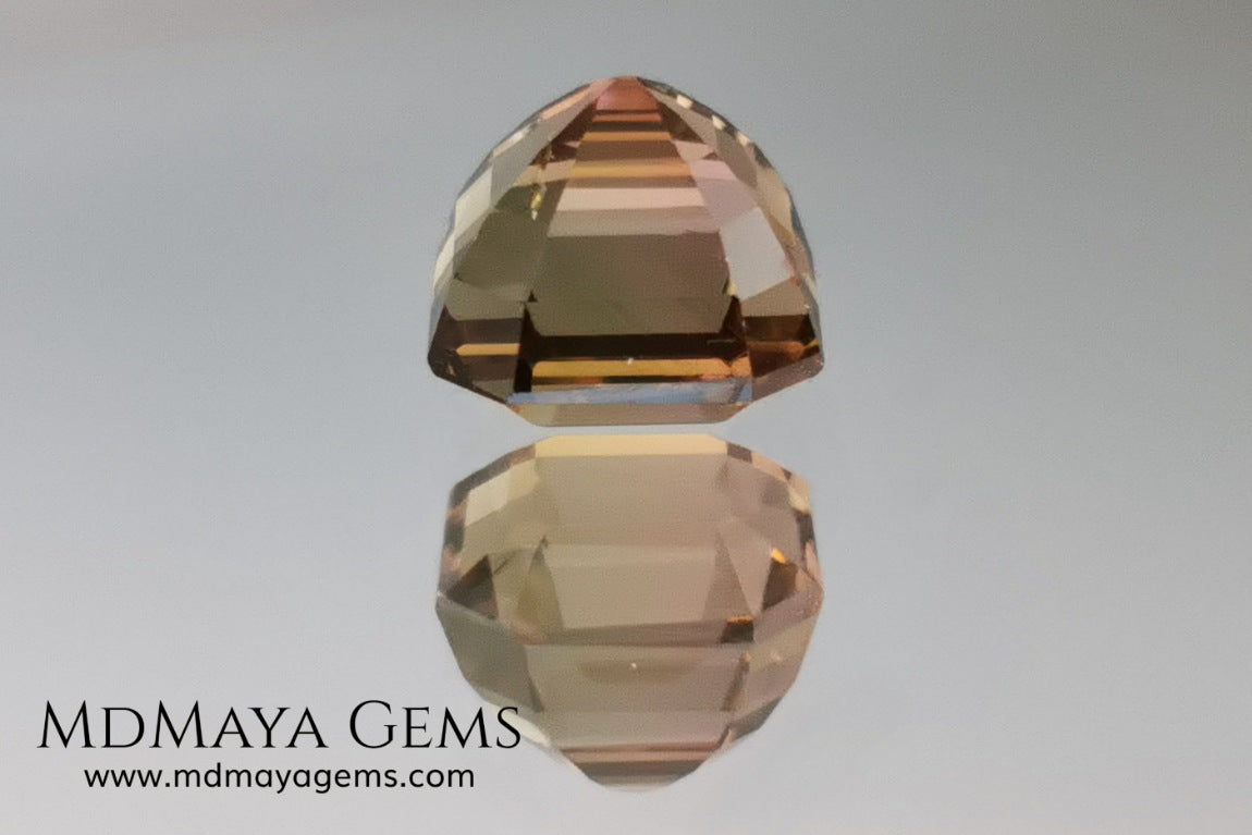 Rose Gold Bicolor tourmaline. Asscher cut 2.62 ct.  Bicolor tourmaline, whose two colors are a greenish yellow and a reddish pink. Once the light falls on the crown of the gem, these colors mix, resulting in a very elegant and saturated golden copper. Thanks to its color, its good cut quality and proportions, it will be an exceptional gem to mount on any type of jewel.