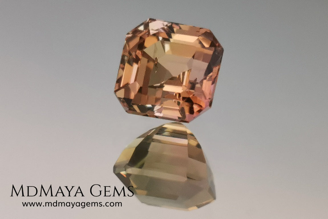 Rose Gold Bicolor tourmaline. Asscher cut 2.62 ct.  Bicolor tourmaline, whose two colors are a greenish yellow and a reddish pink. Once the light falls on the crown of the gem, these colors mix, resulting in a very elegant and saturated golden copper. Thanks to its color, its good cut quality and proportions, it will be an exceptional gem to mount on any type of jewel.