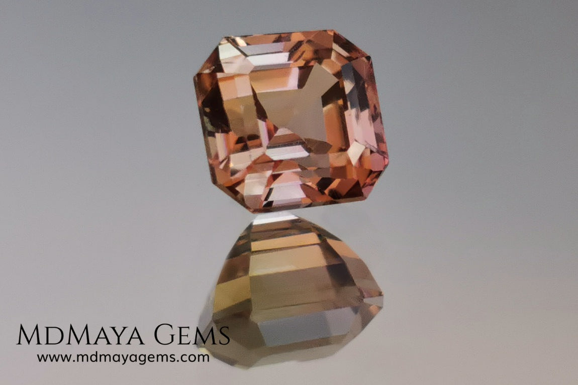 Rose Gold Bicolor tourmaline. Asscher cut 2.62 ct.  Bicolor tourmaline, whose two colors are a greenish yellow and a reddish pink. Once the light falls on the crown of the gem, these colors mix, resulting in a very elegant and saturated golden copper. Thanks to its color, its good cut quality and proportions, it will be an exceptional gem to mount on any type of jewel.