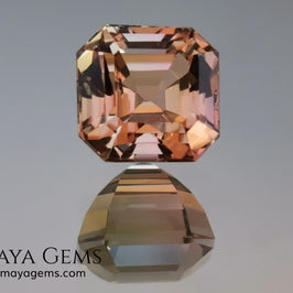 Rose Gold Bicolor tourmaline. Asscher cut 2.62 ct.  Bicolor tourmaline, whose two colors are a greenish yellow and a reddish pink. Once the light falls on the crown of the gem, these colors mix, resulting in a very elegant and saturated golden copper. Thanks to its color, its good cut quality and proportions, it will be an exceptional gem to mount on any type of jewel.