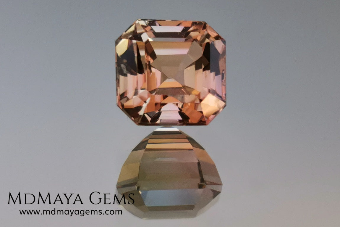 Rose Gold Bicolor tourmaline. Asscher cut 2.62 ct.  Bicolor tourmaline, whose two colors are a greenish yellow and a reddish pink. Once the light falls on the crown of the gem, these colors mix, resulting in a very elegant and saturated golden copper. Thanks to its color, its good cut quality and proportions, it will be an exceptional gem to mount on any type of jewel.