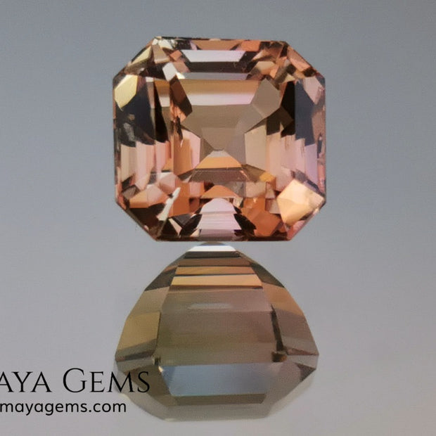 Rose Gold Bicolor tourmaline. Asscher cut 2.62 ct.  Bicolor tourmaline, whose two colors are a greenish yellow and a reddish pink. Once the light falls on the crown of the gem, these colors mix, resulting in a very elegant and saturated golden copper. Thanks to its color, its good cut quality and proportions, it will be an exceptional gem to mount on any type of jewel.