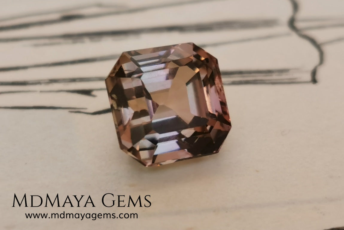 Rose Gold Bicolor tourmaline. Asscher cut 2.62 ct.  Bicolor tourmaline, whose two colors are a greenish yellow and a reddish pink. Once the light falls on the crown of the gem, these colors mix, resulting in a very elegant and saturated golden copper. Thanks to its color, its good cut quality and proportions, it will be an exceptional gem to mount on any type of jewel.