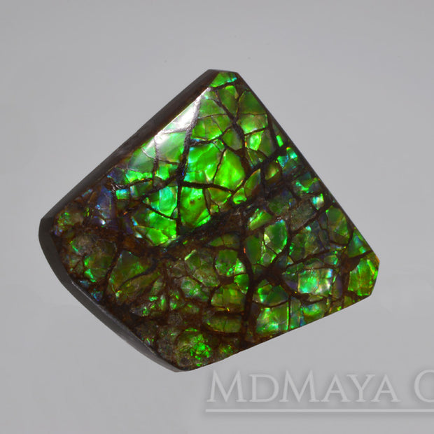 Iridescent Green Ammolite Gemstone 28.24 ct freeform Cabochon 