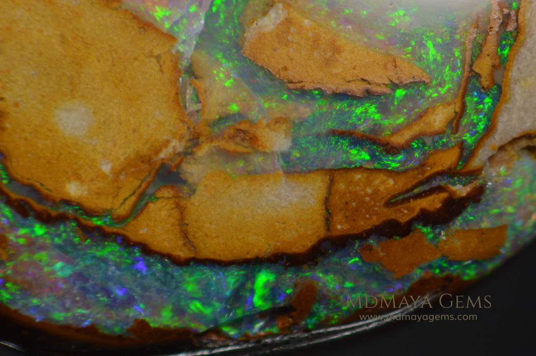 Colorful Australian Boulder Opal 6.13 ct under microscope