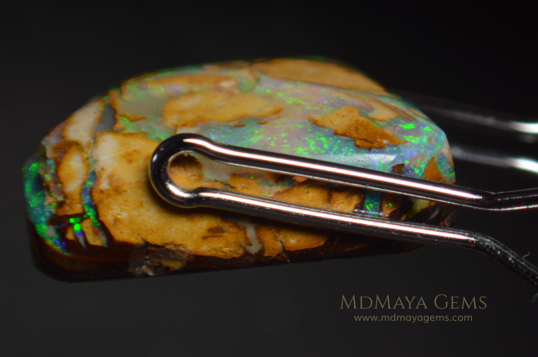 Colorful Australian Boulder Opal 6.13 ct under microscope