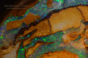 Colorful Australian Boulder Opal 6.13 ct under microscope
