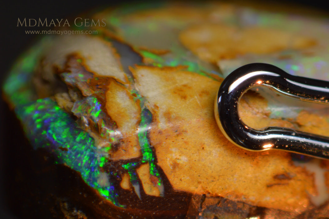 Colorful Australian Boulder Opal 6.13 ct under microscope