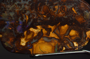 Natural Solid Matrix Boulder Opal 9.76 ct under microscope