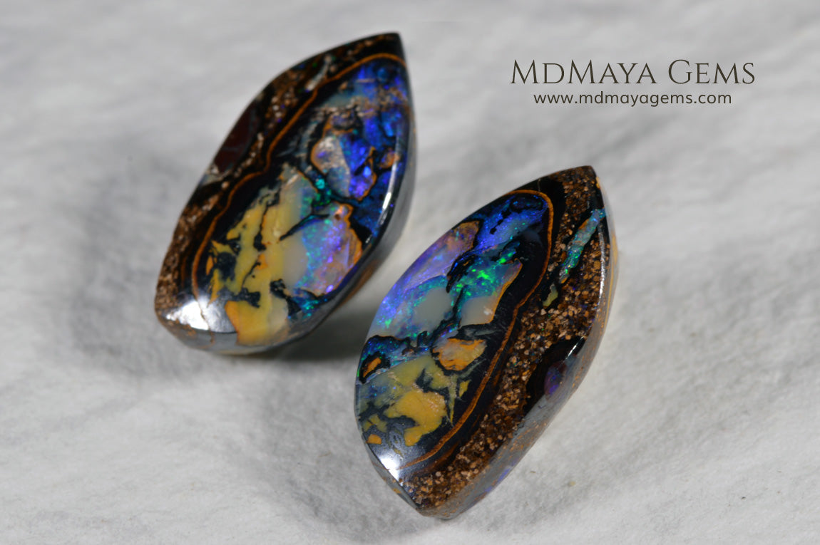  Australian Boulder Wood Fossil Opal Pair. Cabochon Oval Cut. 10.45 ct. 