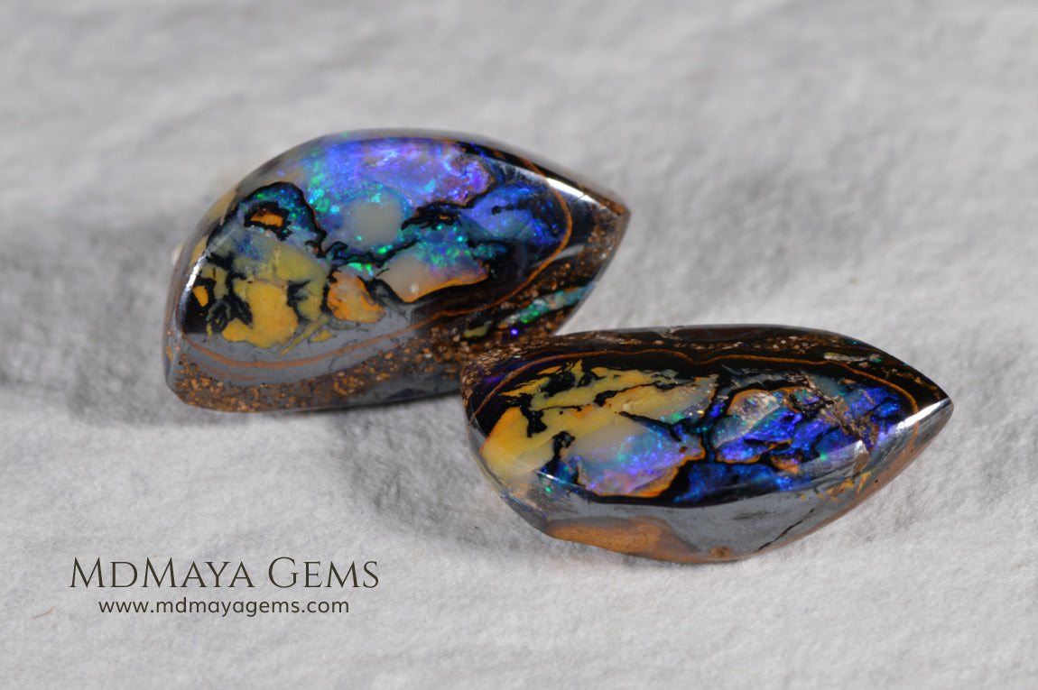  Australian Boulder Wood Fossil Opal Pair. Cabochon Oval Cut. 10.45 ct. 