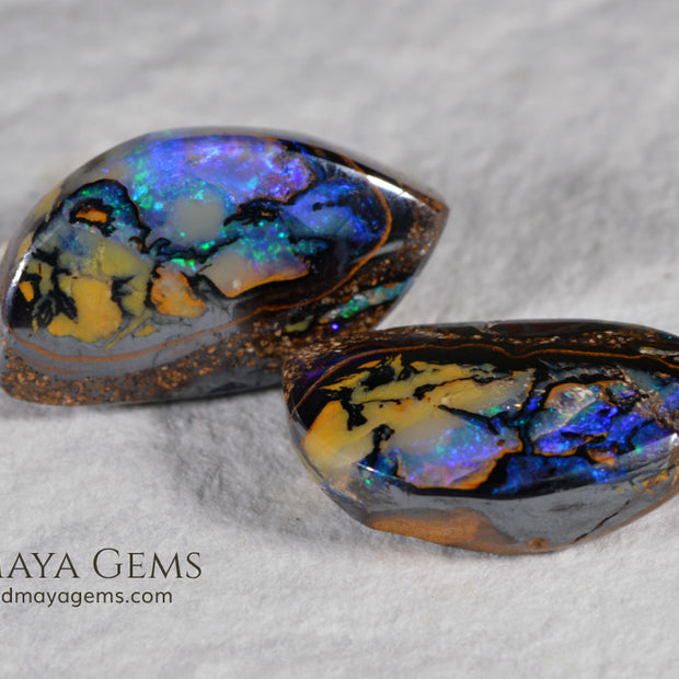 Australian Boulder Wood Fossil Opal Pair. Cabochon Oval Cut. 10.45 ct. 