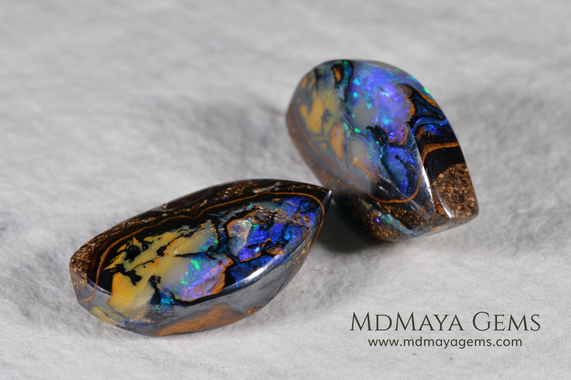  Australian Boulder Wood Fossil Opal Pair. Cabochon Oval Cut. 10.45 ct. 