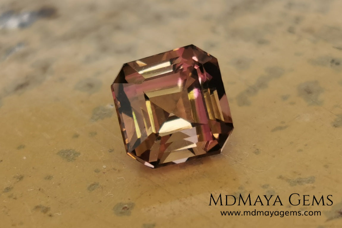 Bicolor, pink and gold tourmaline. Asscher cut. 2.21 ct.  This incredible natural gem has two colors, golden yellow and pink. Both colors coexist mixed, and once the light falls on it it is difficult to separate them; the mix is elegant and luxurious. Great cutting quality. Without a doubt it will be incredible in any piece of jewelry.