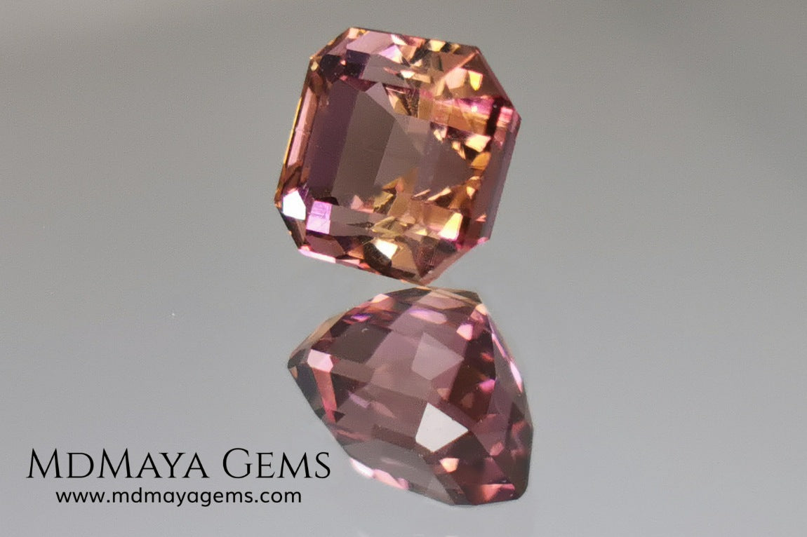 Bicolor, pink and gold tourmaline. Asscher cut. 2.21 ct.  This incredible natural gem has two colors, golden yellow and pink. Both colors coexist mixed, and once the light falls on it it is difficult to separate them; the mix is elegant and luxurious. Great cutting quality. Without a doubt it will be incredible in any piece of jewelry.