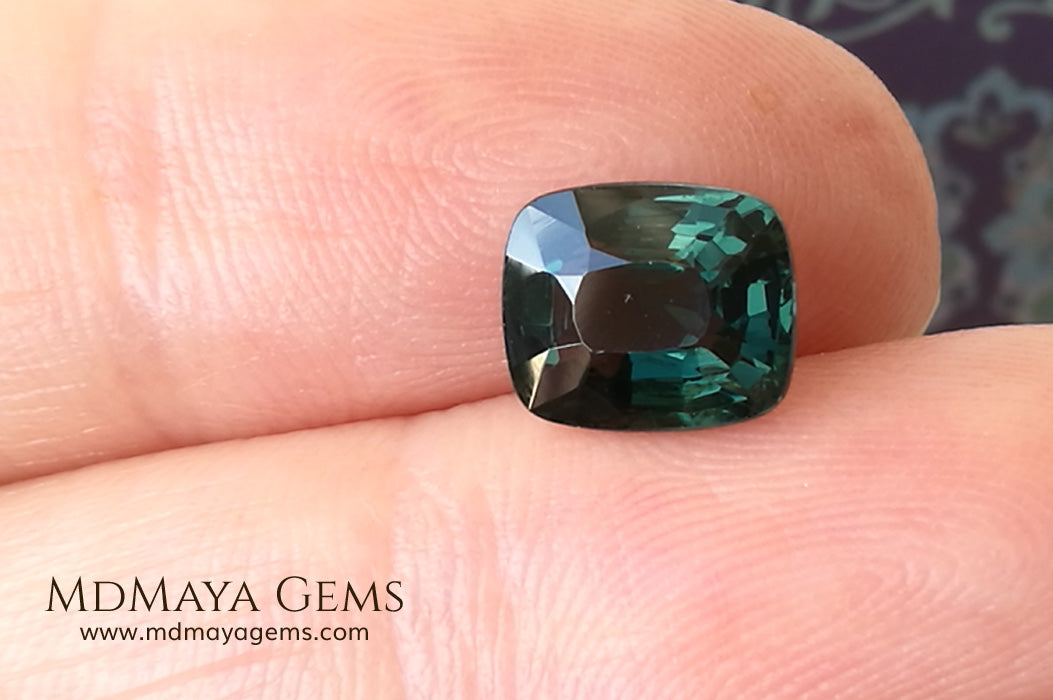 Rare Blue Green Spinel 1.86 ct, cushion cut. This natural and untreated gemstone has an antique cut, its green color is very rare, its size is ideal, neither too big nor too small. Its behavior under light is amazing, has a beautiful and bright color under day light and more green under incandescent light. It will look perfect in your custom jewelry. Spinels are gems with rising value.