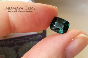 Rare Blue Green Spinel 1.86 ct, cushion cut. This natural and untreated gemstone has an antique cut, its green color is very rare, its size is ideal, neither too big nor too small. Its behavior under light is amazing, has a beautiful and bright color under day light and more green under incandescent light. It will look perfect in your custom jewelry. Spinels are gems with rising value.