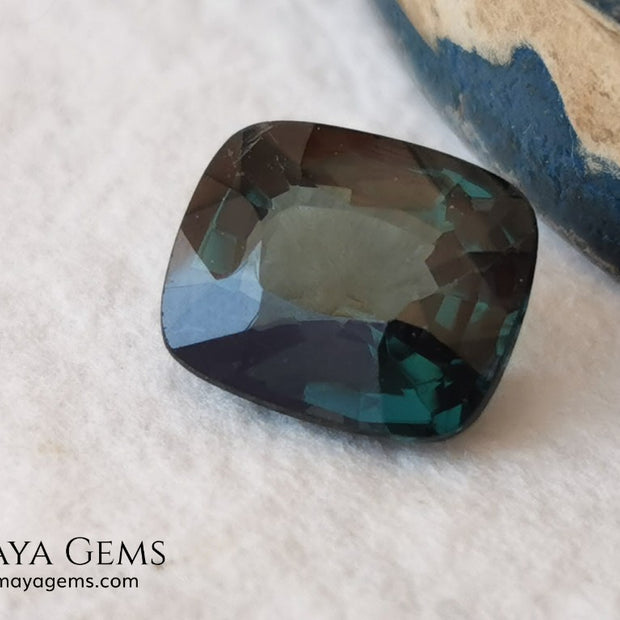 Rare Blue Green Spinel 1.86 ct, cushion cut. This natural and untreated gemstone has an antique cut, its green color is very rare, its size is ideal, neither too big nor too small. Its behavior under light is amazing, has a beautiful and bright color under day light and more green under incandescent light. It will look perfect in your custom jewelry. Spinels are gems with rising value.