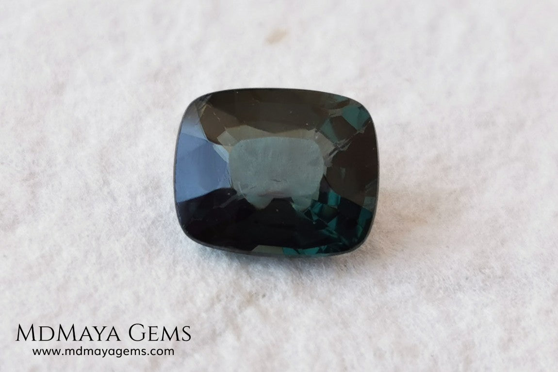 Rare Blue Green Spinel 1.86 ct, cushion cut. This natural and untreated gemstone has an antique cut, its green color is very rare, its size is ideal, neither too big nor too small. Its behavior under light is amazing, has a beautiful and bright color under day light and more green under incandescent light. It will look perfect in your custom jewelry. Spinels are gems with rising value.