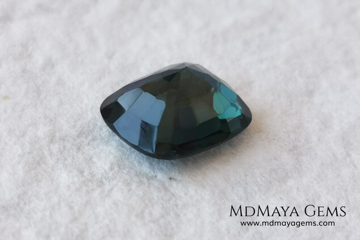 Rare Blue Green Spinel 1.86 ct, cushion cut. This natural and untreated gemstone has an antique cut, its green color is very rare, its size is ideal, neither too big nor too small. Its behavior under light is amazing, has a beautiful and bright color under day light and more green under incandescent light. It will look perfect in your custom jewelry. Spinels are gems with rising value.