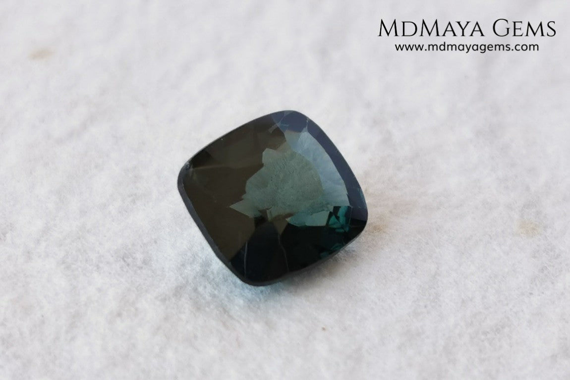 Rare Blue Green Spinel 1.86 ct, cushion cut. This natural and untreated gemstone has an antique cut, its green color is very rare, its size is ideal, neither too big nor too small. Its behavior under light is amazing, has a beautiful and bright color under day light and more green under incandescent light. It will look perfect in your custom jewelry. Spinels are gems with rising value.