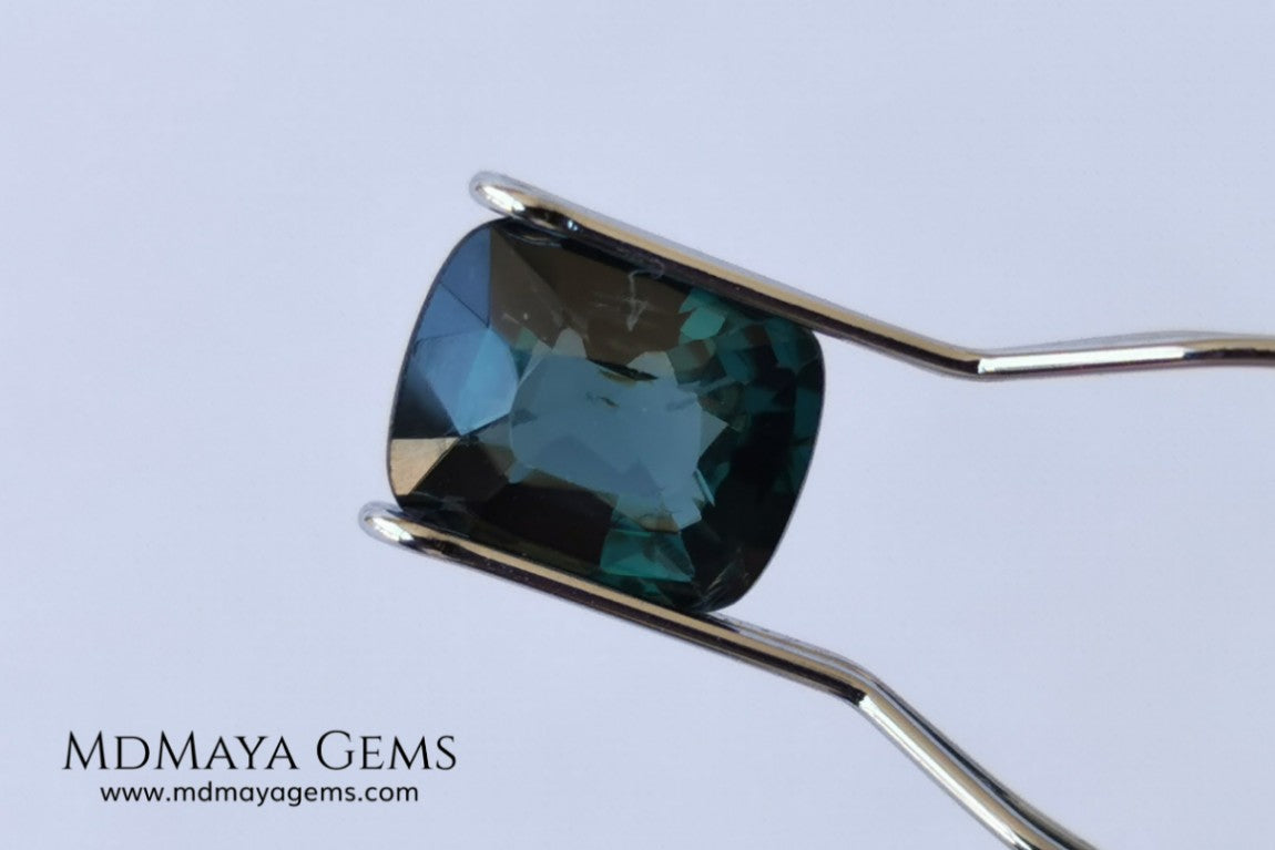 Rare Blue Green Spinel 1.86 ct, cushion cut. This natural and untreated gemstone has an antique cut, its green color is very rare, its size is ideal, neither too big nor too small. Its behavior under light is amazing, has a beautiful and bright color under day light and more green under incandescent light. It will look perfect in your custom jewelry. Spinels are gems with rising value.