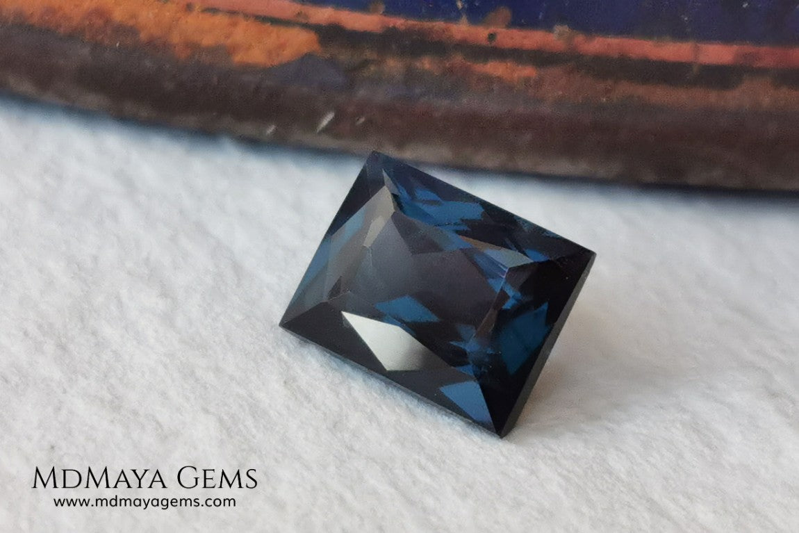  Affordable Blue Grey Spinel Gemstone. Rectangle Cut. 2.14 ct. Maximum brilliance. This gem has a beautiful behavior under any type of light, it has a dark blue color full of bright sparkles. Inclusions visible only under the lens.  Beautiful gemstone for your personalized jewelry.