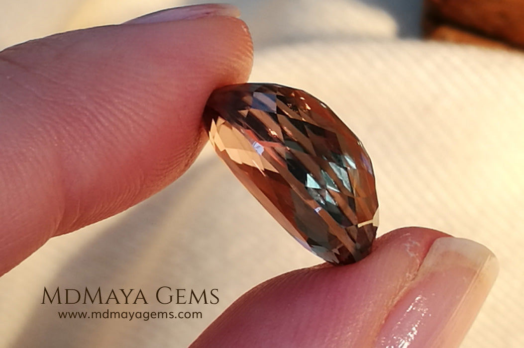 Color Change Diaspore Gemstone 12.03 ct under different lighting conditions