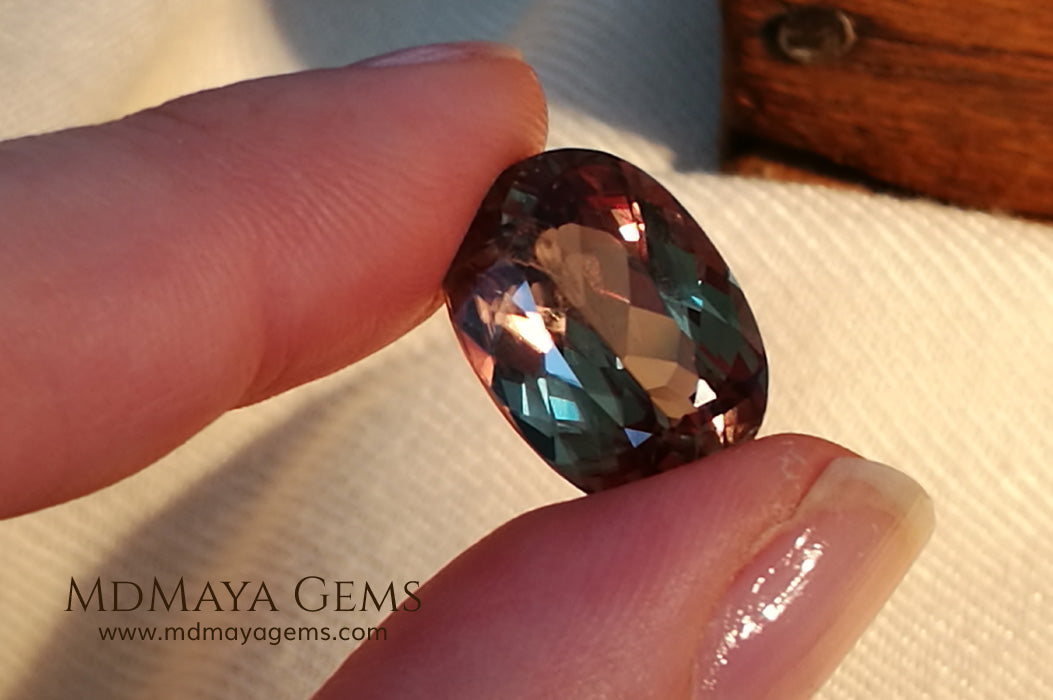 Color Change Diaspore Gemstone 12.03 ct under different lighting conditions