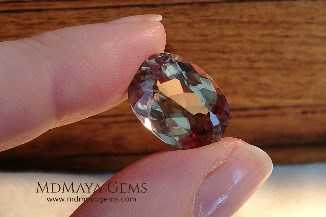 Color Change Diaspore Gemstone 12.03 ct under different lighting conditions