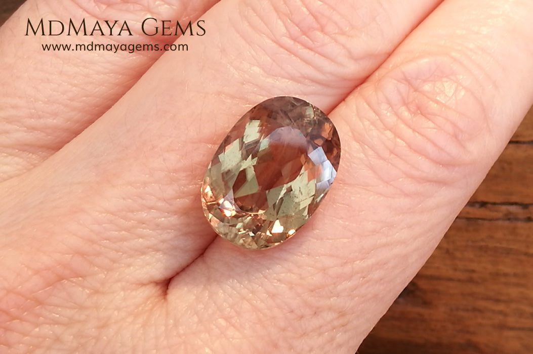 Color Change Diaspore Gemstone 12.03 ct under different lighting conditions