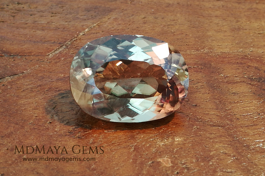 Color Change Diaspore Gemstone 12.03 ct under different lighting conditions