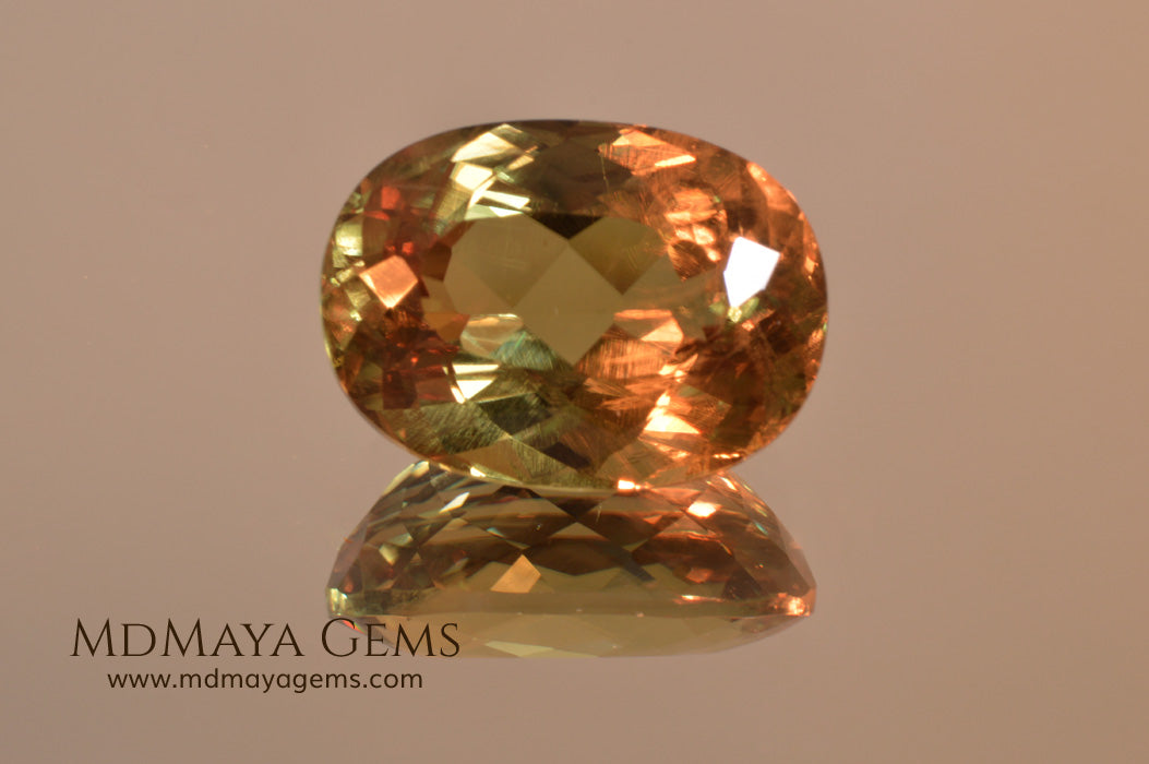 Color Change Diaspore Gemstone 12.03 ct under different lighting conditions